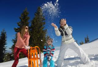 Winter season. Happy family having fun on fresh snow on vacation. Winter season. Happy family having fun on fresh snow on vacation.