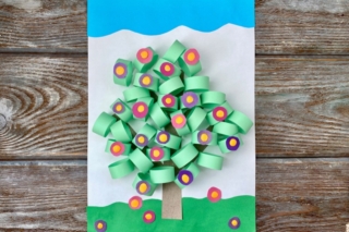 3D applique of colored paper, volume, spring tree with flowers, on a wooden background, handmade. 3D applique of colored paper, volume, spring tree with flowers, on a wooden background, handmade.