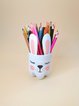The art of handmade recycling from plastic bottle. Crafts ideas for the children's room. A container for pencils in the form of a bunny The art of handmade recycling from plastic bottle. Crafts ideas for the children's room. A container for pencils in the form of a bunny