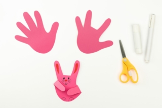DIY and children's creativity. Step-by-step instructions: how to make a hare from paper. Step 3. Cut the paper along the contour of your palm. Cut off your middle finger. Draw a rabbit's face. DIY and children's creativity. Step-by-step instructions: how to make a hare from paper. Step 3. Cut the paper along the contour of your palm. Cut off your middle finger. Draw a rabbit's face.