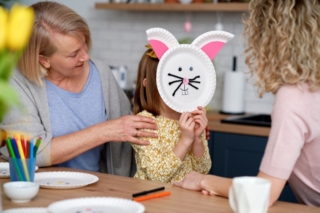Girl have fun during making handmade Easter decorations Girl have fun during making handmade Easter decorations