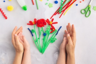Handmade fluffy wire flowers craft with kids women's mother's day gift present hands Handmade fluffy wire flowers craft with kids women's mother's day gift present hands