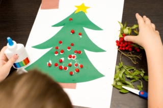 Christmas,Tree,Made,Of,Green,Paper.,Child,Decorates,With,Rowan Christmas,Tree,Made,Of,Green,Paper.,Child,Decorates,With,Rowan