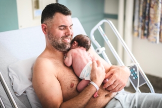 A,New,Born,Baby,Boy,Resting,In,Father,Arms