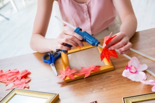 Woman,Decorating,Picture,Frame,In,Scrapbooking,Concept Woman,Decorating,Picture,Frame,In,Scrapbooking,Concept