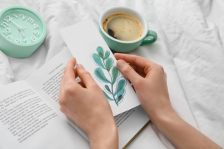 Woman,With,Bookmark,And,Book,On,Bed Woman,With,Bookmark,And,Book,On,Bed