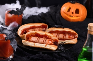 Plate of hot dogs Bloody fingers on a Halloween table Plate of hot dogs Bloody fingers on a Halloween table